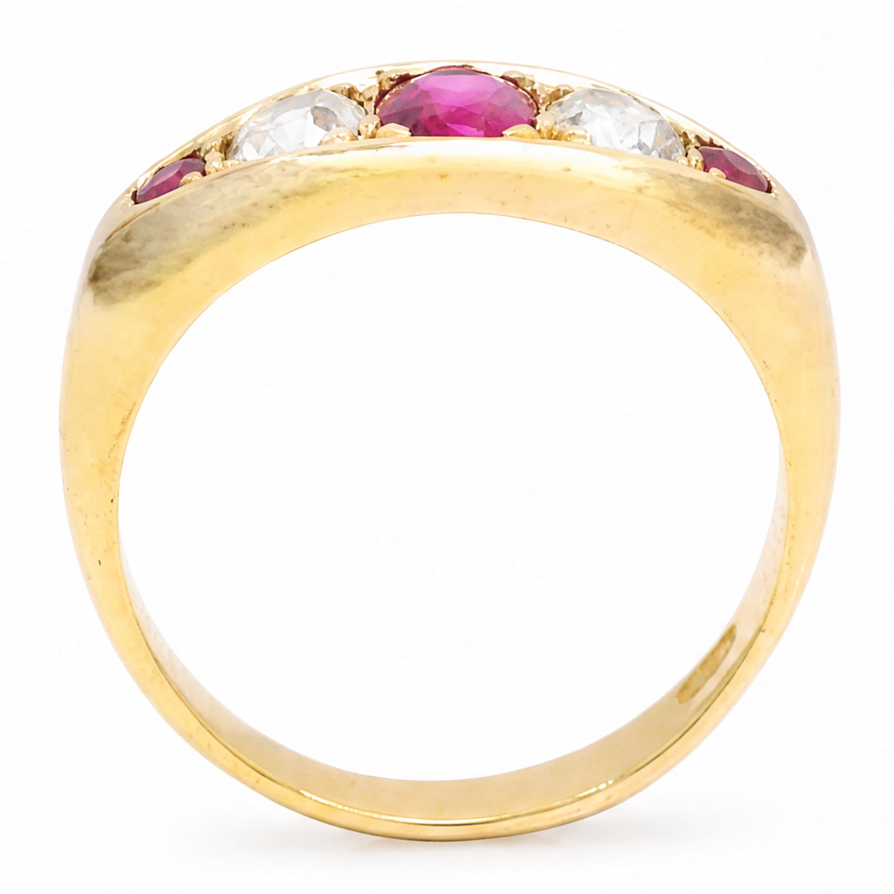 Early 20th century gold ruby and diamond five stone marquise set ring, principal oval cut ruby of approx 0.60 carat, flanked by two old cut diamonds and two round cut rubies, stamped 18ct, total diamond weight approx 0.80 carat