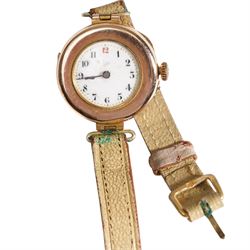 Two 9ct gold manual wind wristwatches, hallmarked, on on a leather strap, the other on a expanding gold-plated strap
