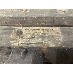 Early 20th century wood and metal bound zinc travelling trunk, hinged top with three clasps, decorated with period luggage labels