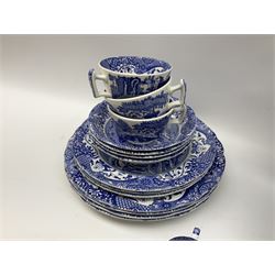 Spode blue and white Italian pattern dinner and tea wares, comprising five dinner plates, four side plates, seventeen side plates, four bowls, ten tea cups and twenty one saucers, five coffee cans and six saucers, and a flan dish, with blue and black printed marks beneath 