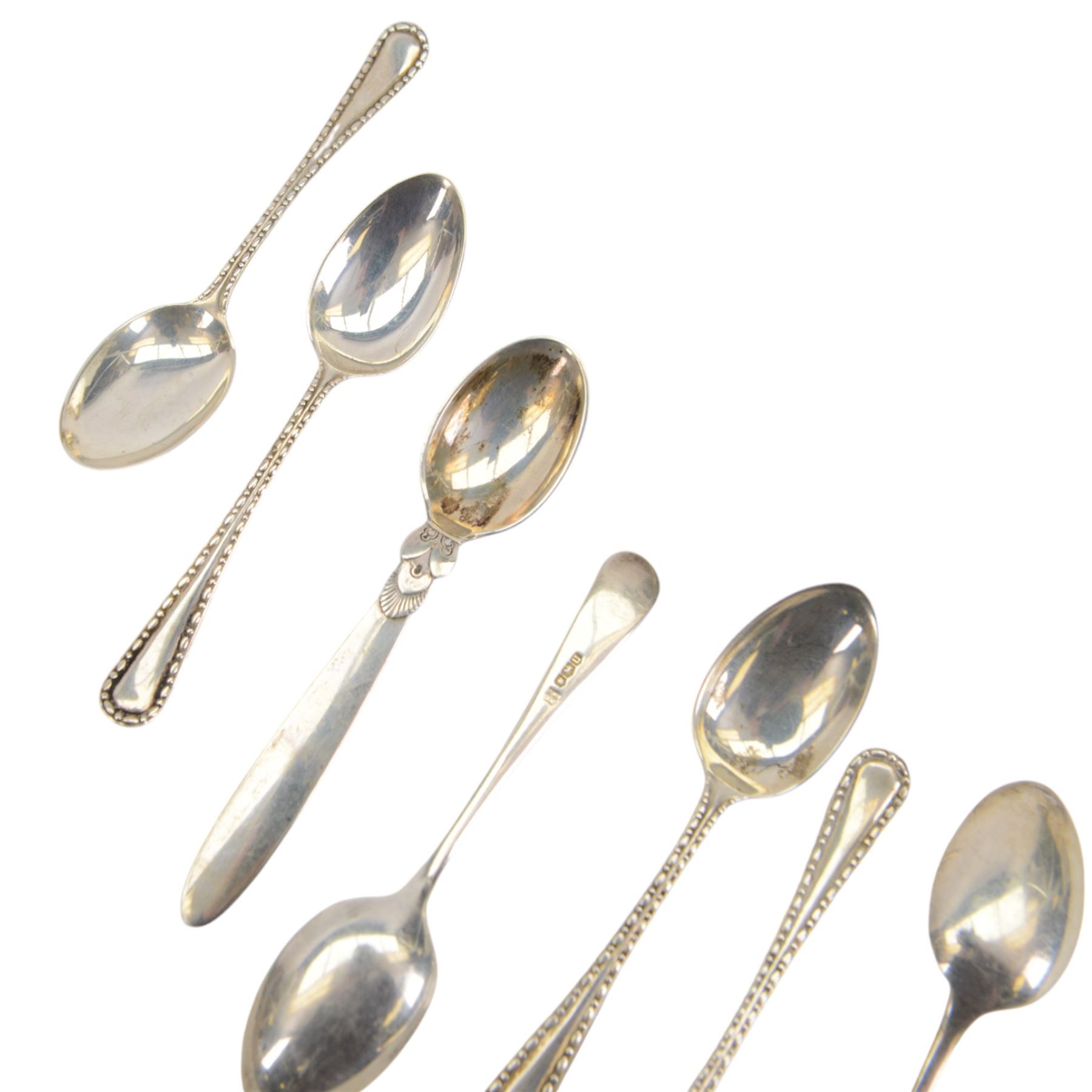 Danish silver demitasse spoon, stamped Georg Jensen, Sterling, Denmark, together with two sets of early 20th century silver coffee spoons, all hallmarked