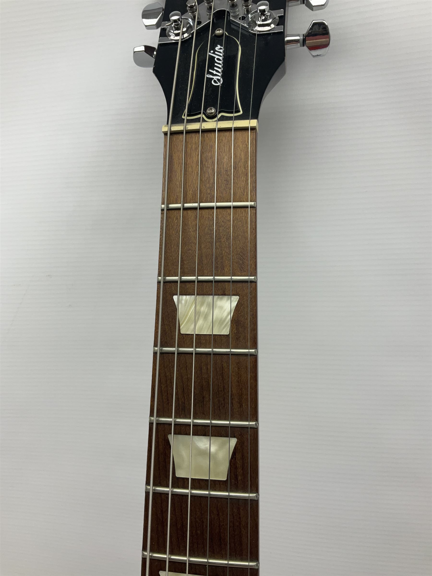2012 American Gibson Les Paul Studio electric guitar, retro fitted with iron gear pick-ups, push-pull 'pots', roller bridge, string butler and locking machines, serial no.115321594, L99cm overall; in Gibson soft carrying case.