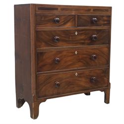 Early 19th century mahogany chest, straight front with canted corners, featuring inlaid de...