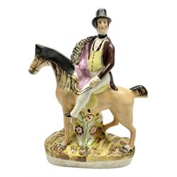 19th century Staffordshire figure of Robert Peel, titled 'Sir Robert Peel', modelled on horseback, atop an oval plinth base featuring a naturalistic and floral design, H30cm 