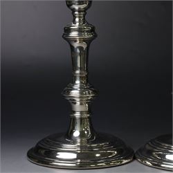 Pair of silver candlesticks, with knopped stems and upon spreading circular weighted bases, hallmarked William Comyns & Sons Ltd, London 1979, H20cm