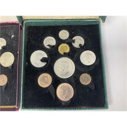 Three King George VI 1951 'Festival Of Britain' specimen coin sets, each comprising farthing to crown coins, housed in maroon, green and blue dated boxes 