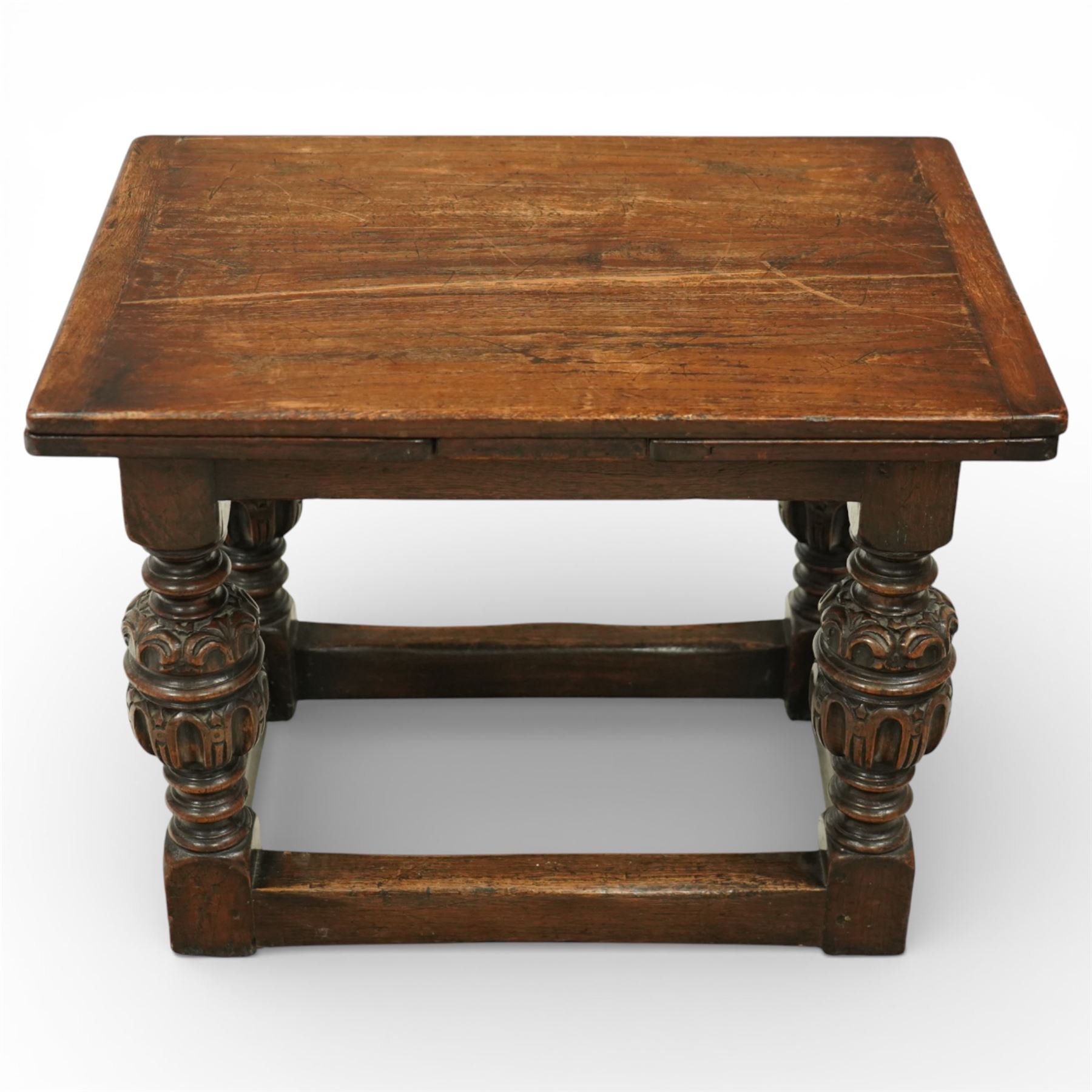 Miniature Elizabethan style oak draw-leaf table, rectangular top with two opposing draw leaves, raised on four bulbous turned supports united by peripheral stretchers