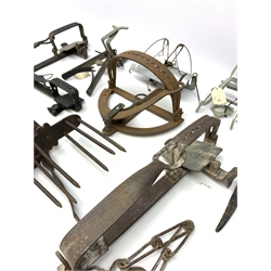 Nine animal traps including gin traps by E. Tinsley & Co, Lewis Angio Devon etc, various style mole traps by A. Fenn, Henry Lane, J. Duffus & Son etc. Auctioneer's Note: These traps are sold as artefacts for ornamental purposes only as the use of some of them is illegal.