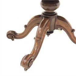 Victorian mahogany breakfast table, circular moulded tilt top on turned pedestal, four shaped out splayed supports with scroll carved terminals, brass and ceramic castors