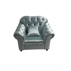 Chesterfield shaped armchair, upholstered in buttoned light blue fabric, with scatter cushions
