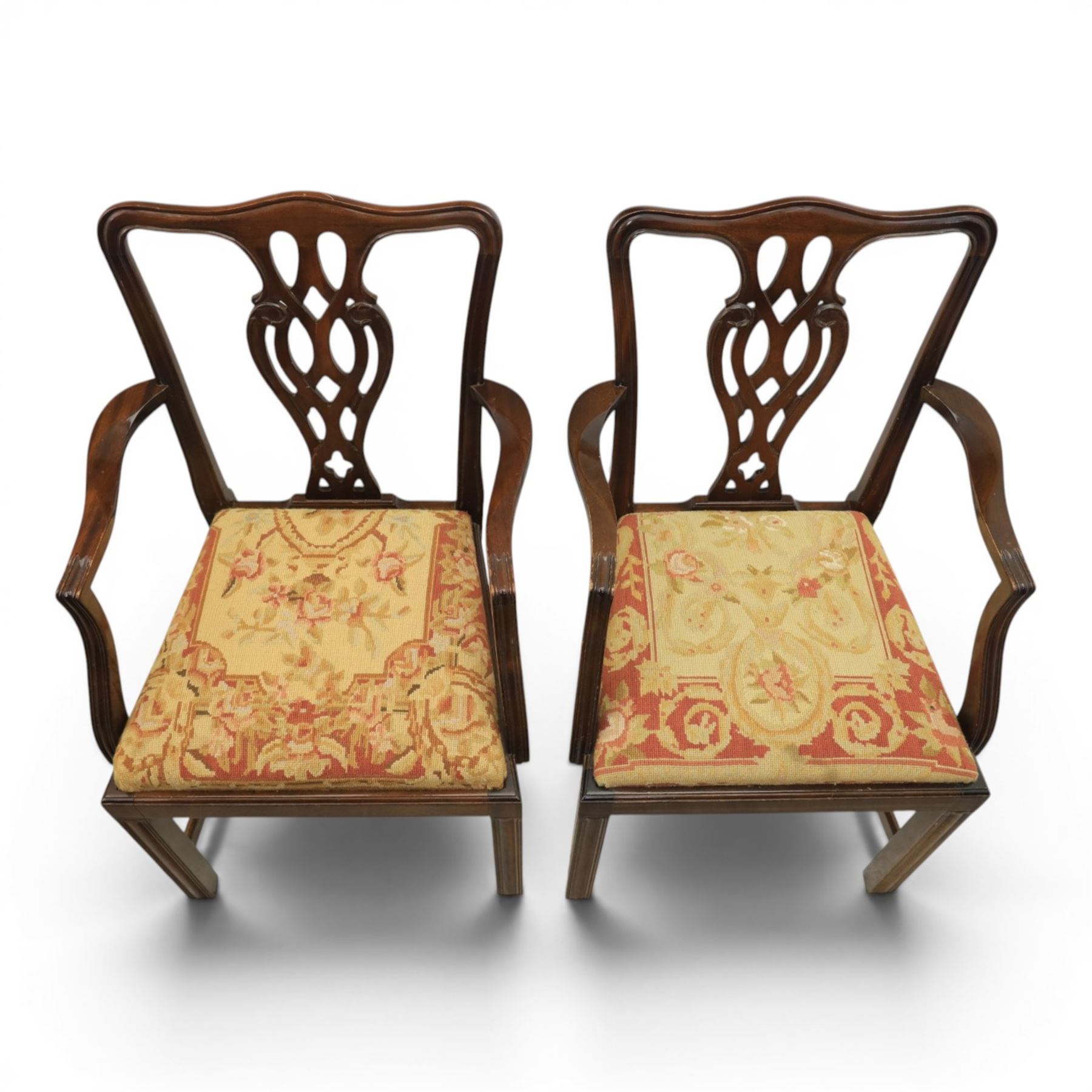 Large 19th century mahogany extending dining table with set of Chippendale design chairs, extending dining table with rectangular moulded top additional three leaves, raised on turned supports terminating in brass castors, the dining chairs (2 + 2) with shaped cresting rail and pierced splats, raised on square supports with stretchers