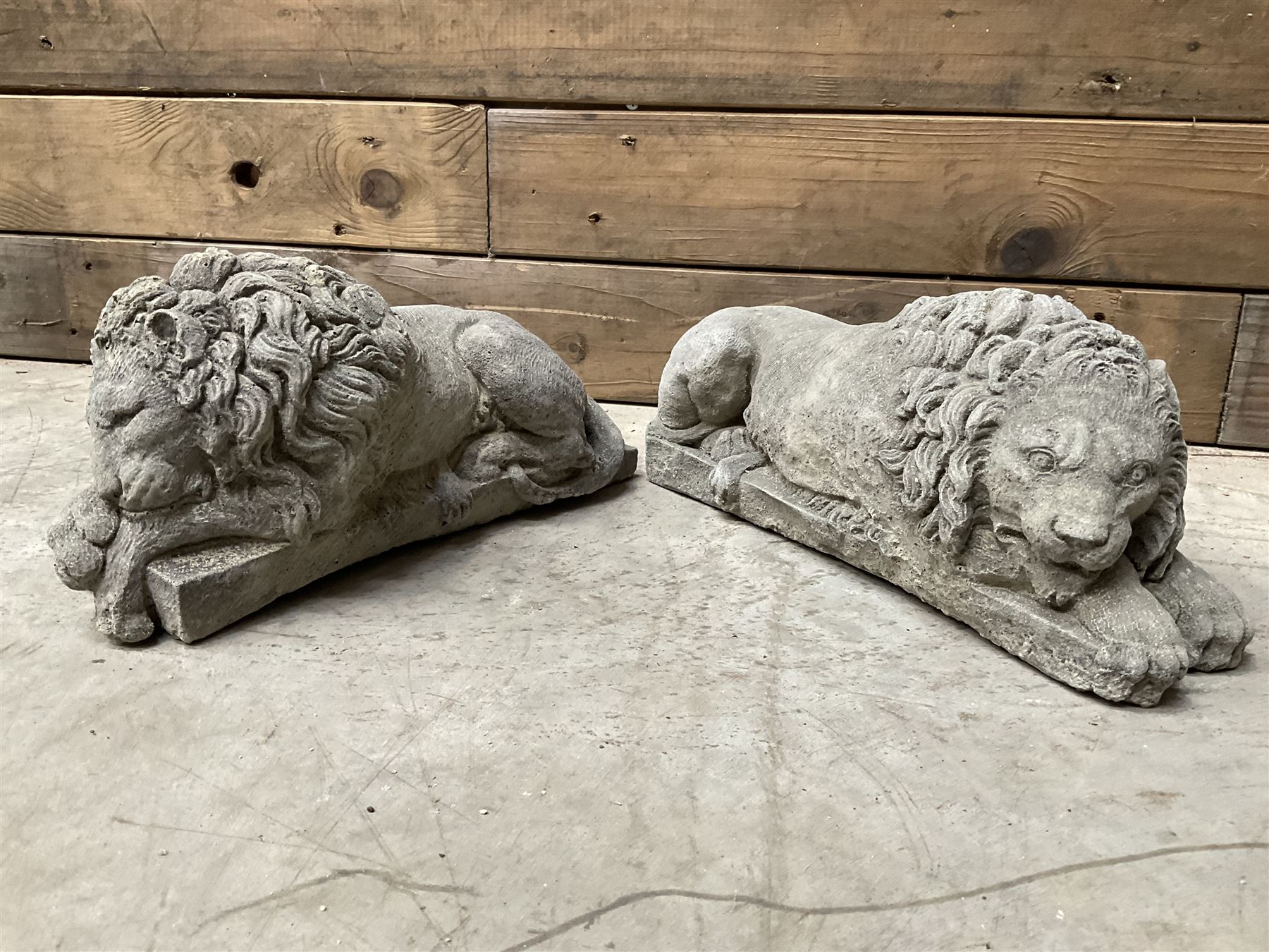Pair of small cast stone sleeping Trafalgar Lions