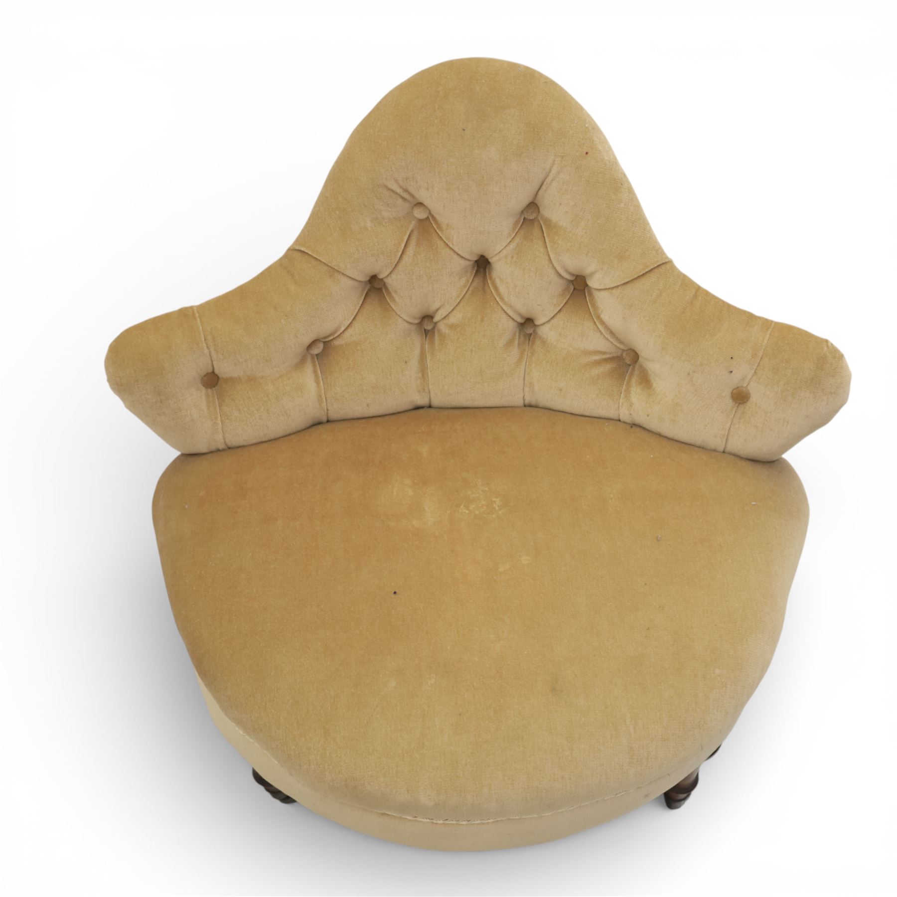 20th century pair of bedroom chairs upholstered in buttoned taupe velour, each of slipper chair form with low wraparound back and deep seat, the backs button tufted with padded wings, raised on turned front supports with castors