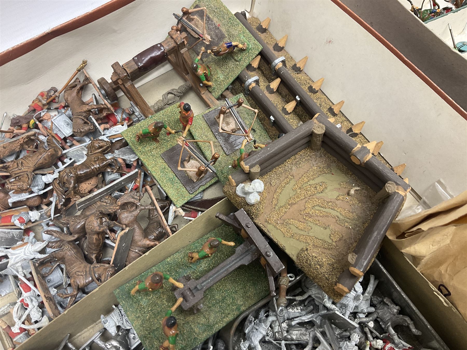 Painted metal wargame figures - over four hundred including Normans and Saxons, Romans, British Tribes etc; together with a quantity of part-painted and unpainted figures, battlefield weapons and accessories etc; average size 25mm