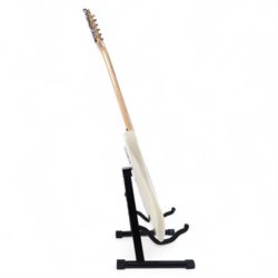 Fender Stratocaster electric guitar, serial no. P093223 made in Japan c.1993, with cream body, white scratch plate, maple neck, three pickups, three control dials and five way selector switch, in a black Fender USA hardcase, guitar L99cm