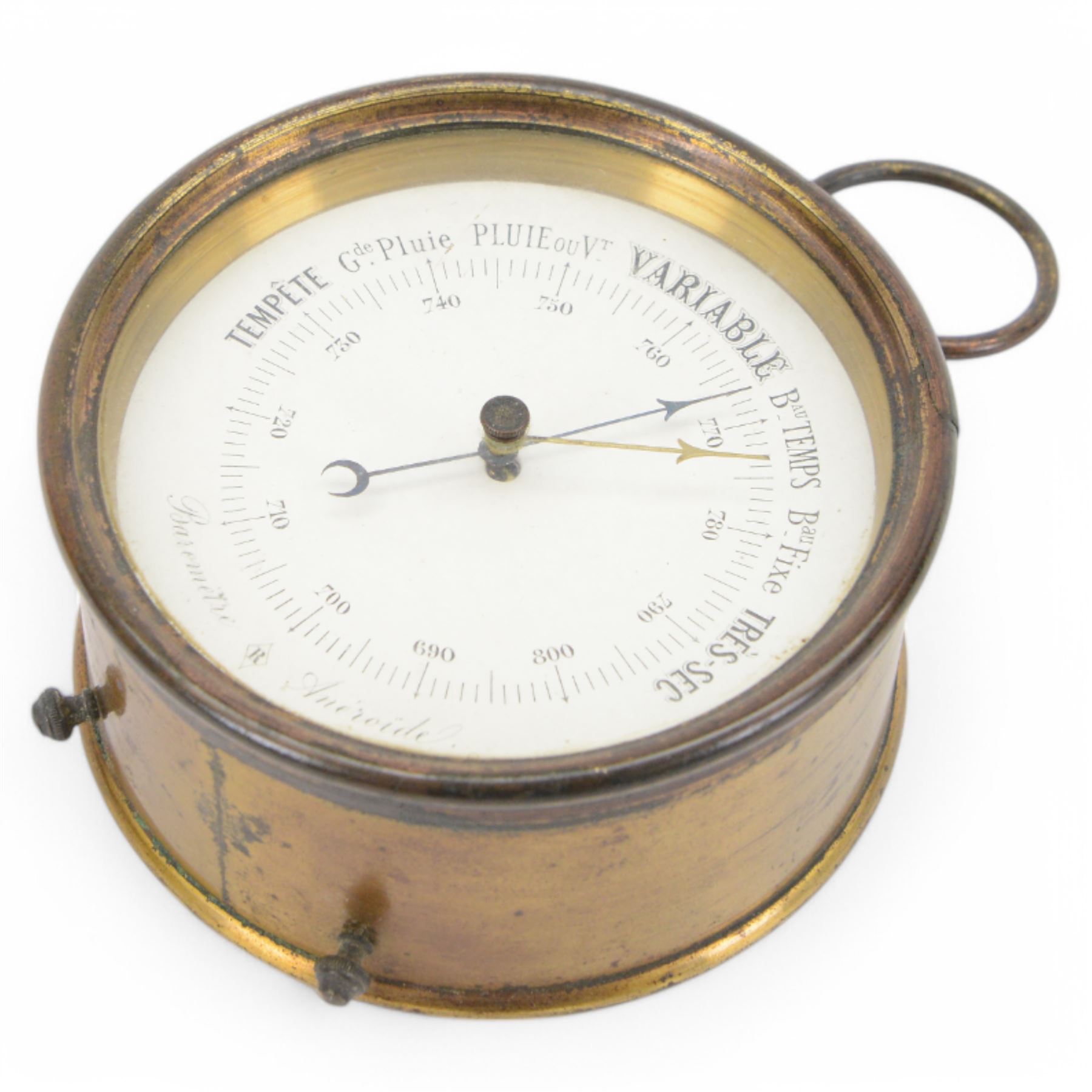 French- late 19th century desktop aneroid barometer in a circular gilt metal case with carrying ring, 3.5 inch paper printed register with predictions and barometric air pressure, with a steel indicating hand and brass recording hand, adjustment screw to the rear.
