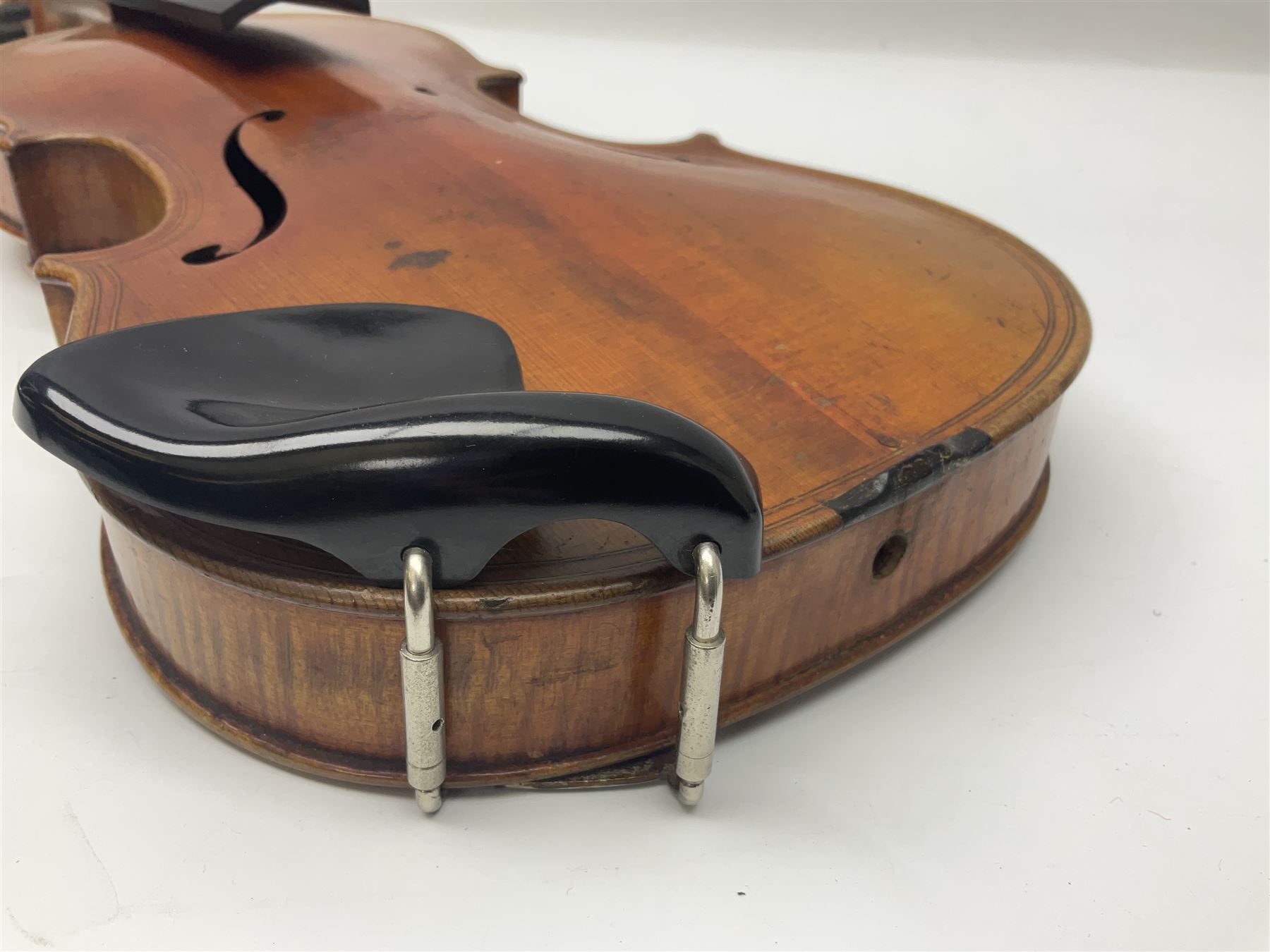 German trade violin c1900 copy of a Maggini with 36.5cm two-piece maple back and ribs and spruce top; double scroll; L60cm overall; in carrying case