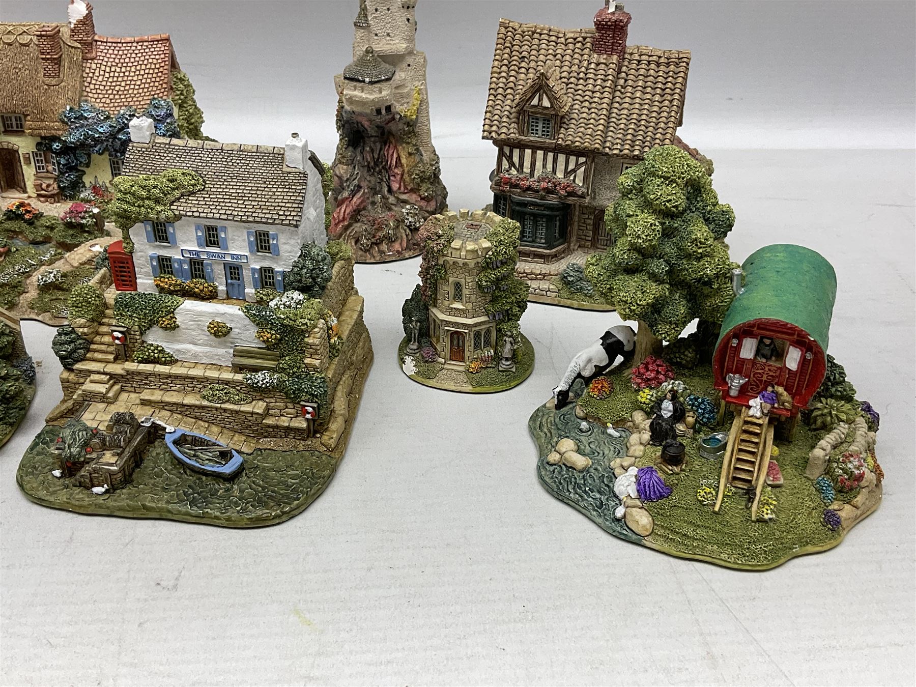 Sixteen Lilliput Lanes, to include The Golden Jubilee, Round Tower - Windsor Castle, Castle of the Golden Chalice, Travellers Rest, with box and deed,  Summer Days, Sunshine Creek, Writing with Lewis Carol, with box and deed,  etc 