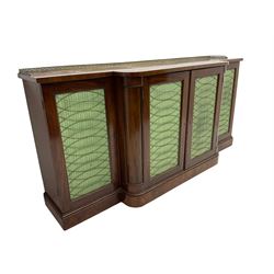 19th century mahogany break-front sideboard, raised brass gallery back with Greek key design, fitted with four cupboard doors, their pleated green fabric overlain with gilt metal grilles, lower moulded edge over plinth base