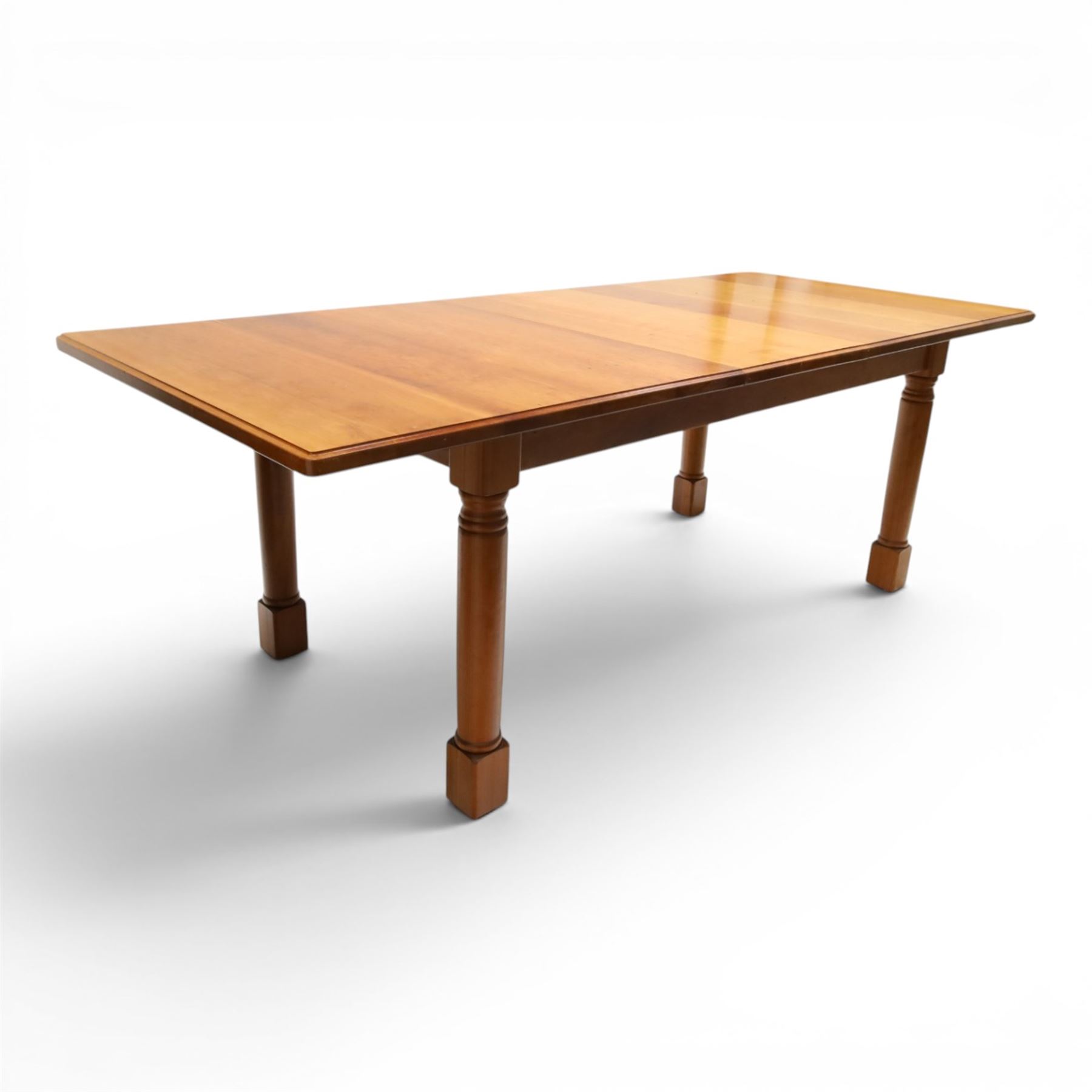 Knightman - cherrywood extending dining table, the rectangular top raised on four turned legs, with additional leaf extending to 230cm total, recessed carved knight trademark, by Horace Knight of Old Mill Furniture, Balk near Thirsk