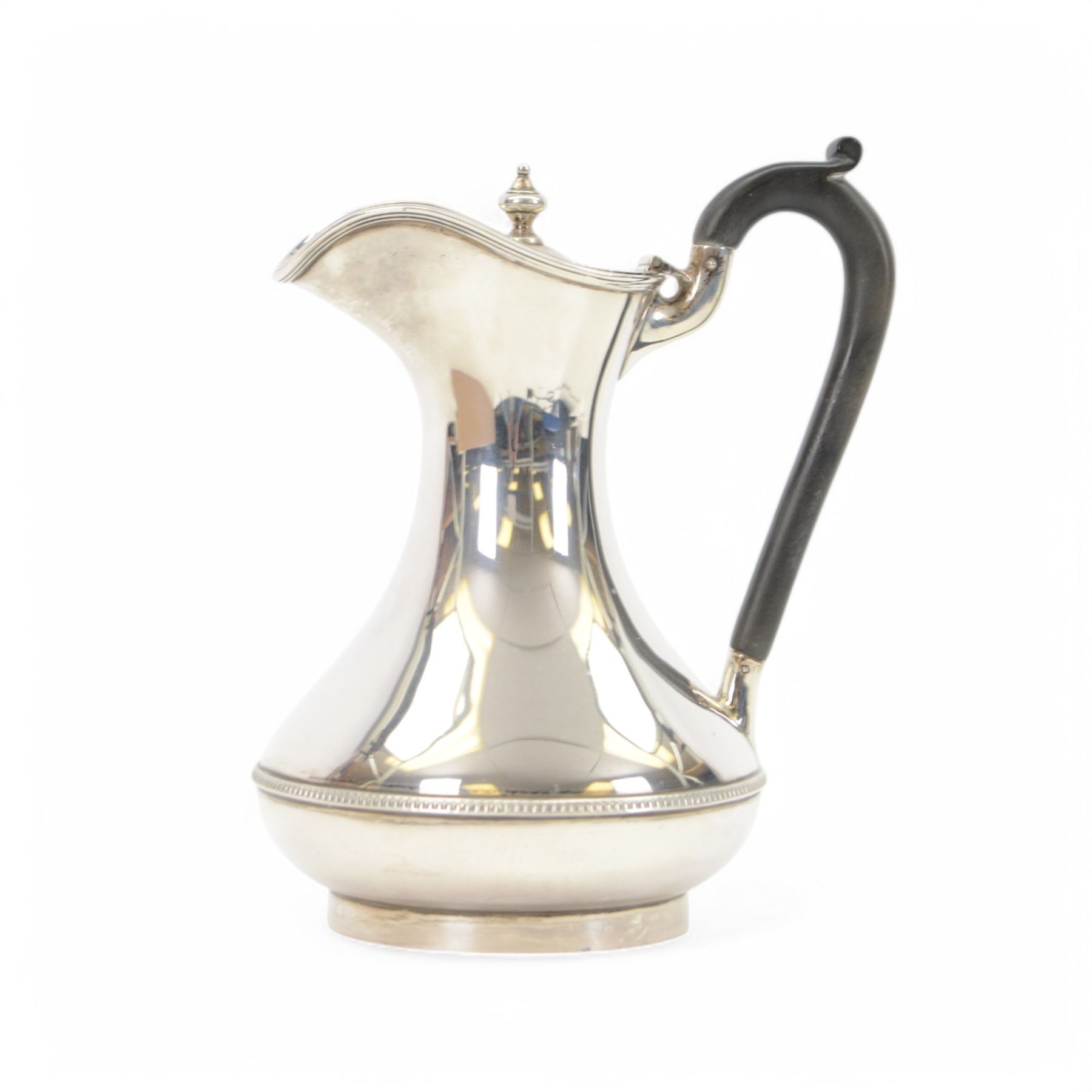 1930s silver hot water pot, of bellied form engraved with monogram to body, with Bakelite type handle and urn finial, hallmarked Fattorini & Sons Ltd, Birmingham 1938, H23cm