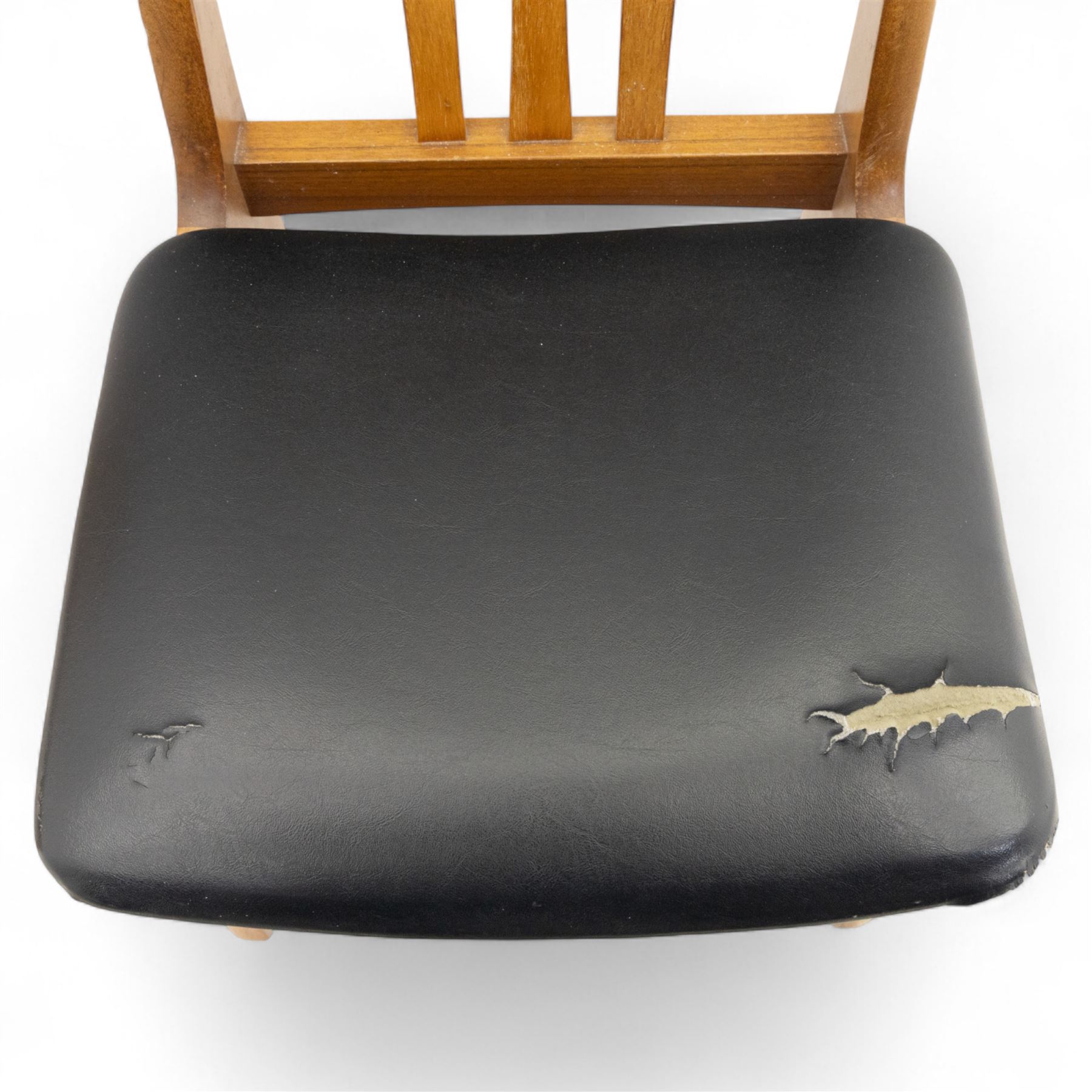 Sutcliffe of Todmorden - mid 20th century ‘S-Form’ teak dining table and chairs, the circular storable extending table with plain veneered top on tapered supports, together with matching dining chairs upholstered in black vinyl, with curved slat backs and shaped front supports, reflecting the sleek organic styling characteristic of 1960s British modern furniture design (Chairs H 93cm, W 46cm, D 46cm) (Extended 168cm)