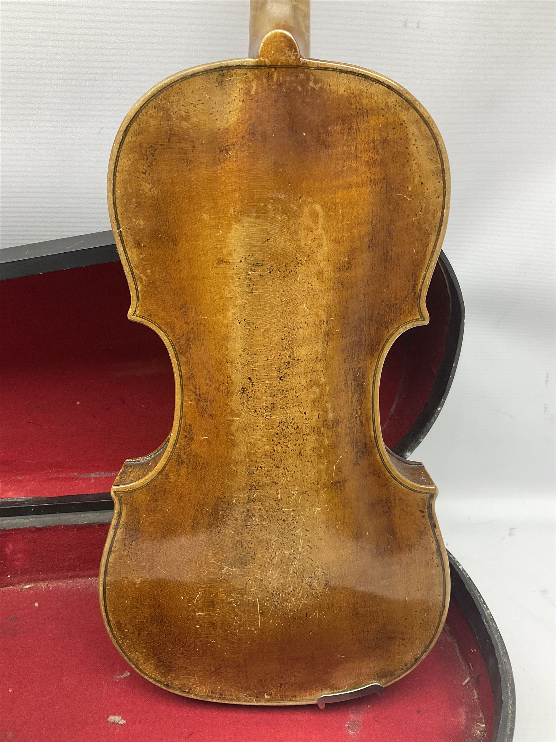 Late 19th century Saxony violin with 36cm one-piece maple back and ribs and spruce top; bears label 'Josef Klotz in Mittenwalde Anno 1795' L60cm overall; in ebonised wooden 'coffin' case