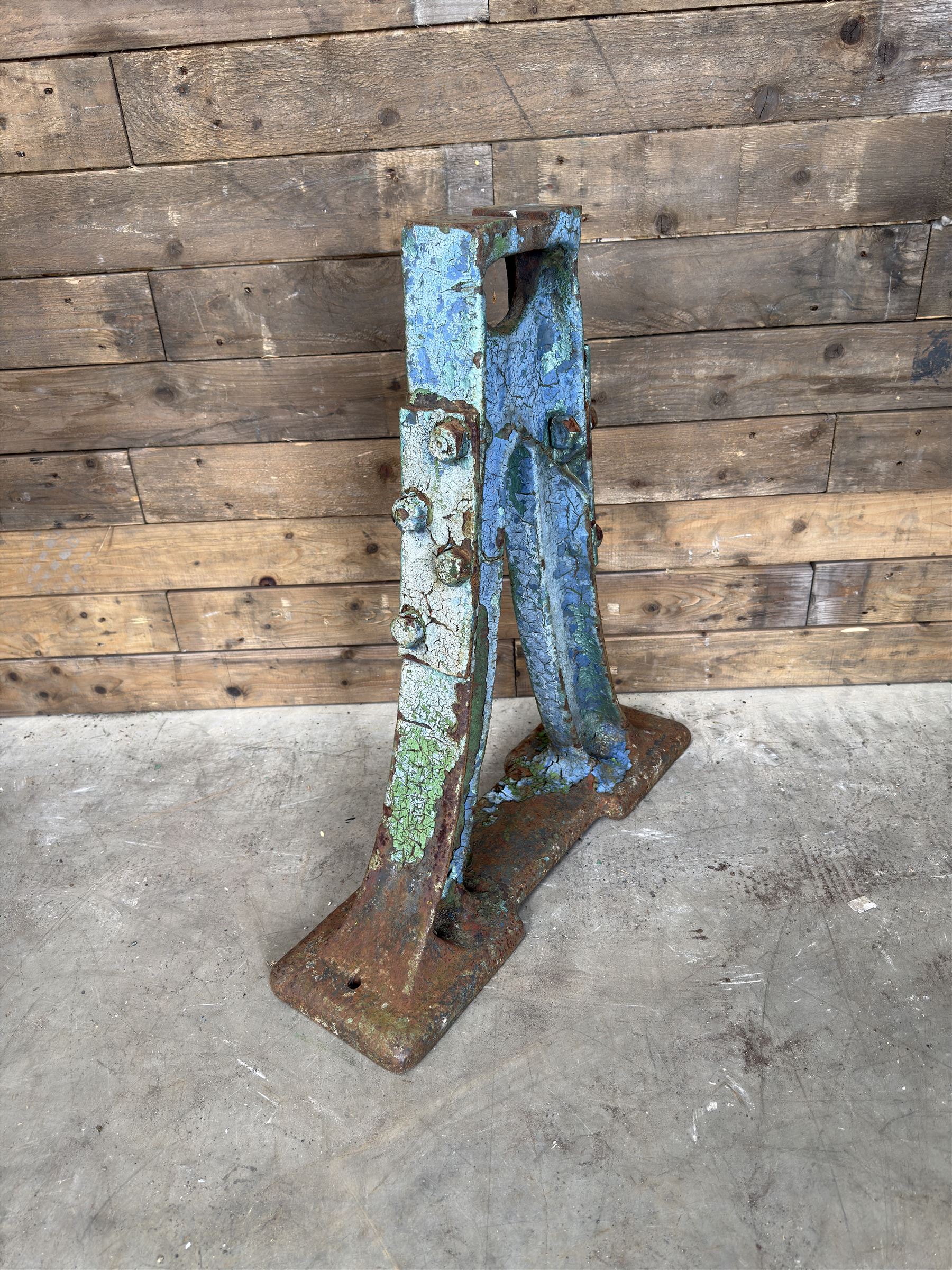 Pair of late 19th century heavy cast iron garden industrial trestles, painted in distressed blue paint