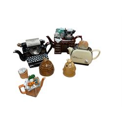 Collection of novelty teapots, together with two honey pots 