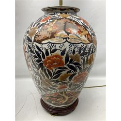 Pair of large and impressive 20th century Japanese Imari table lamps, each of ovoid form, decorated in the Imari palette with roundels containing flowering urns, and shaped panels of birds, set against a white ground decorated with blossoming peonies, lamp base (not including fixtures) H56.5cm overall including shade H89cm