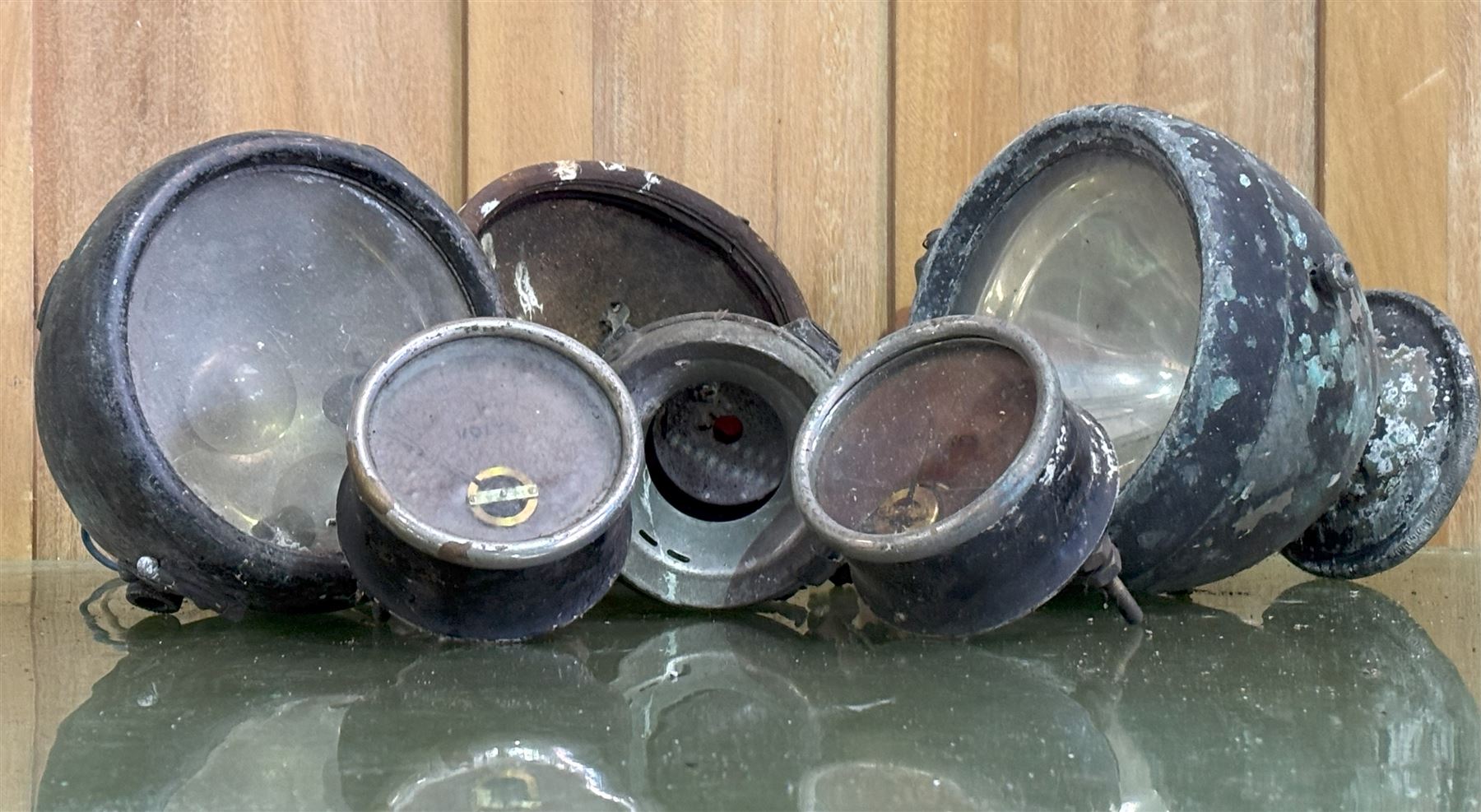 Collection of items of early motor car interest, including a headlight with integrated rear view mirror and bracket, a pair of gauges, one amps and one volts, headlights etc (6) - COLLECTION BY APPOINTMENT FROM: The White House, Thirsk Road, Easingwold, York, YO61 3NF - CALL 01723 507111 TO ARRANGE