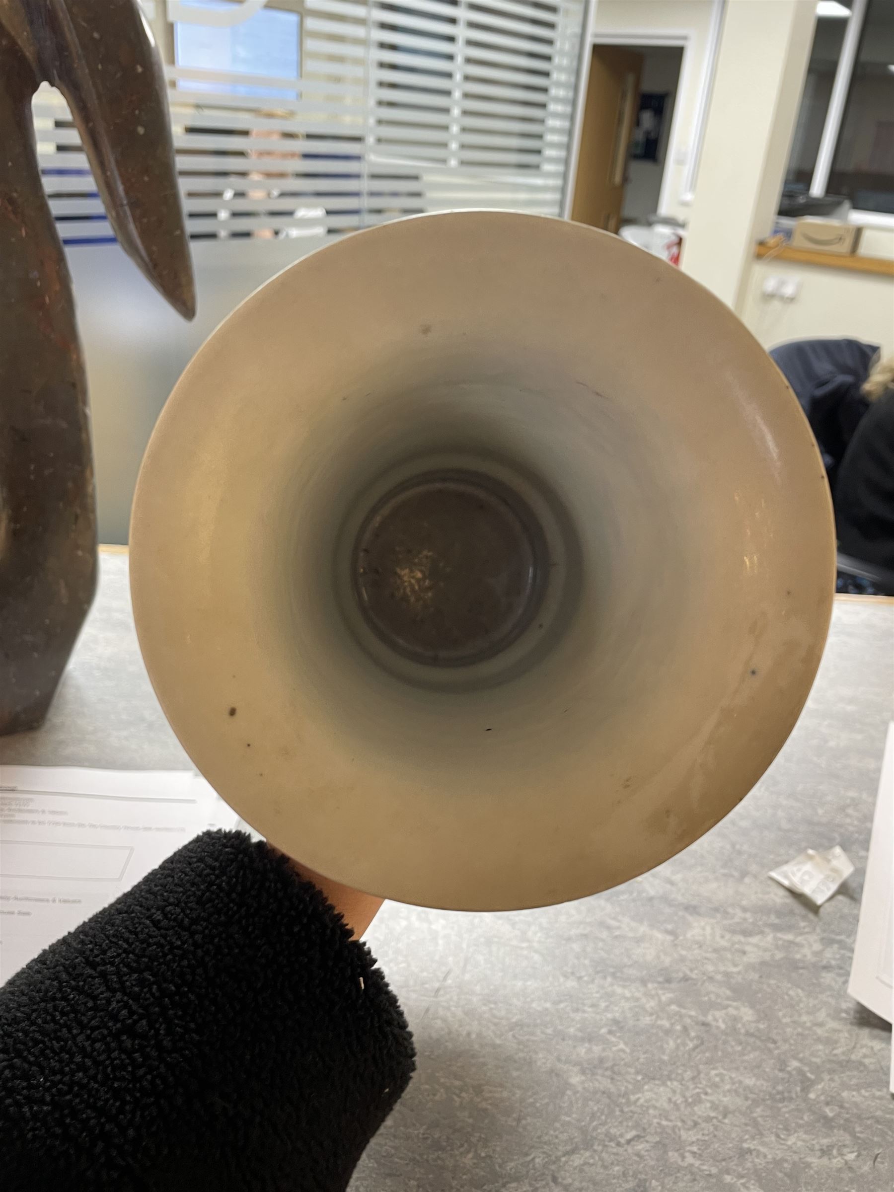 Late 19th century Chinese blue and white gu beaker vase, decorated with two lobed reserves containing precious objects, against a prunus and cracked ice ground, with apocryphal Kangxi mark beneath, H30.5cm