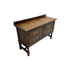 Early 20th century oak sideboard, fitted with four drawers with geometric moulded fascias, raised on turned supports