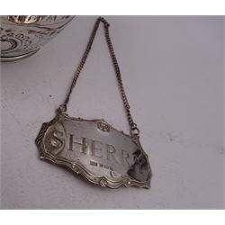 George III silver cream jug, of helmet form with angular handle, embossed with floral and scrolling decoration and engraved initial, hallmarked Edward Mayfield, London 1806, H9.3cm, together with a modern silver 'Sherry' decanter label, hallmarked Birmingham Mint, Birmingham 1986