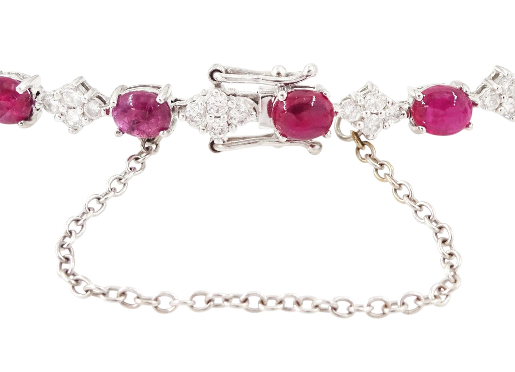18ct white gold ruby and diamond bracelet, fifteen oval cabochon cut rubies, each spaced by four round brilliant cut diamonds, Sheffield 2009, total ruby weight 10.10 carat, total diamond weight approx 0.60 carat