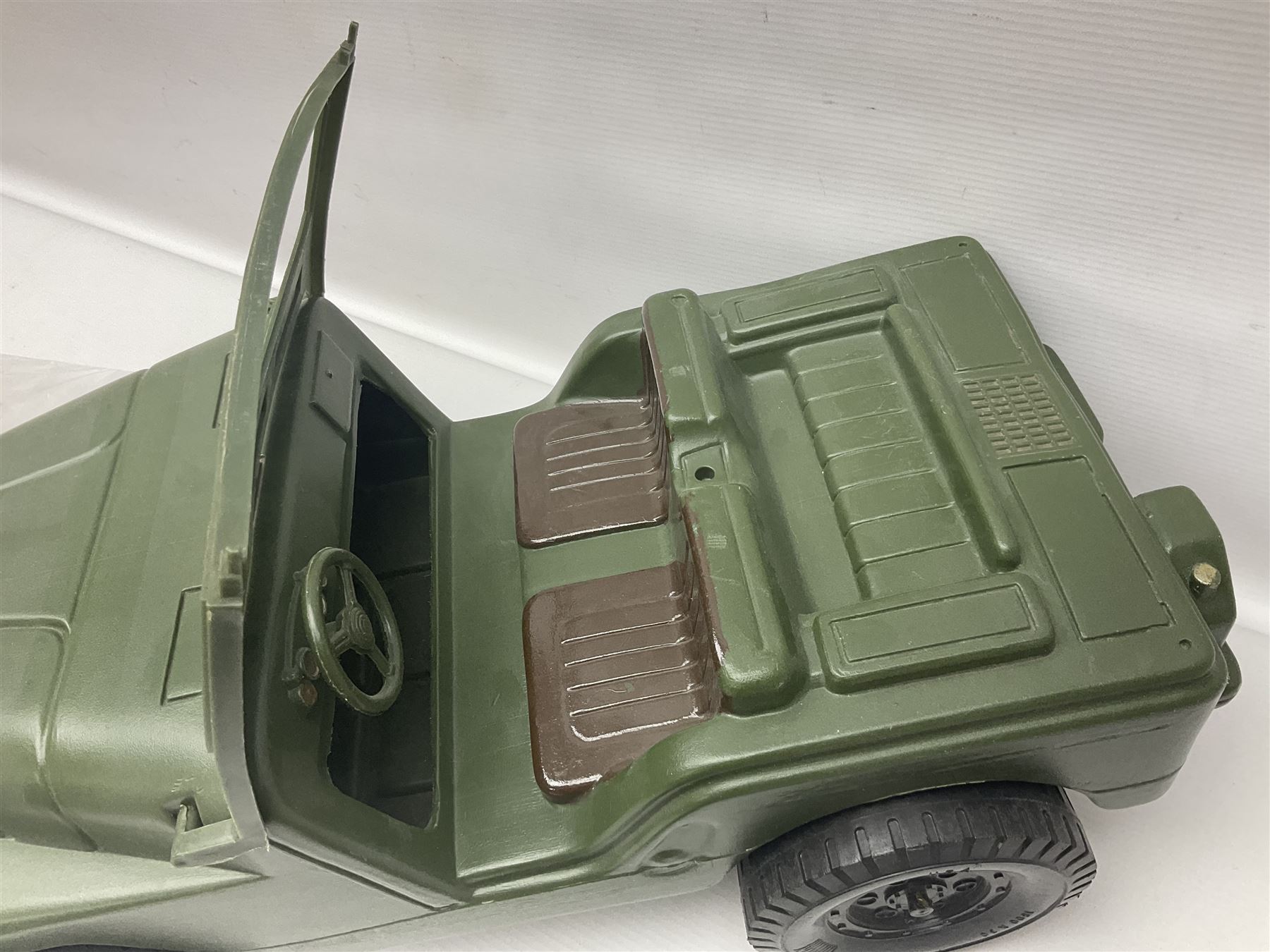 Action Man - five figures marked on the back 'Made in England by Palitoy under licence from Hasbro 1964', one dressed as a German Stormtrooper, one as a Red Devil Pilot and three in army uniform; another similar action figure marked to the right buttock ' G.I. Joe Copyright 1964 by Hasbro Patent Pending Made in Canada' dressed in army uniform; together with an Action Man jeep, field gun, mortar and machine guns and other accessories including helmets and weapons, parachute, diving equipment, skis and snow shoes, boots, uniforms etc; all unboxed