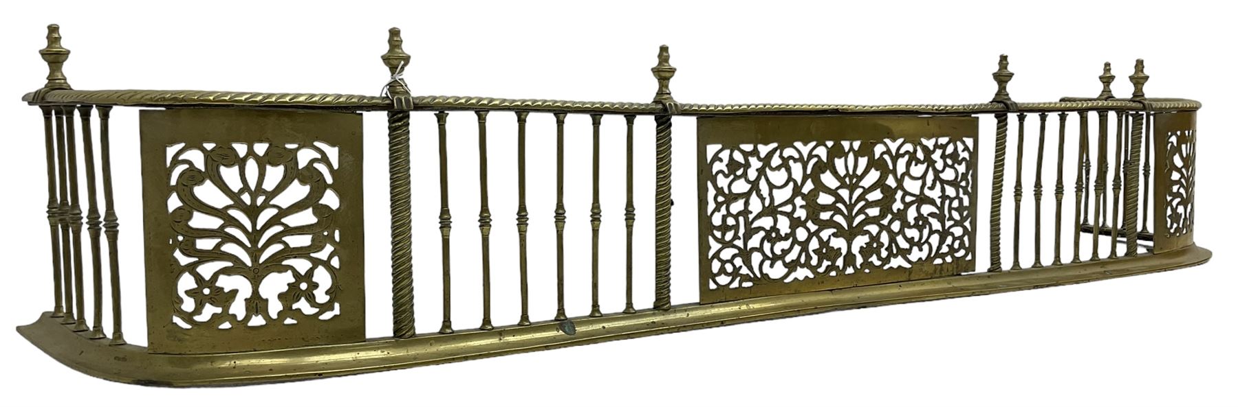 Early 19th century Irish brass D-shaped brass fender, twist borders and balustrade supports, central pierced frieze panel decorated with scrolling foliage and central anthemion motif  