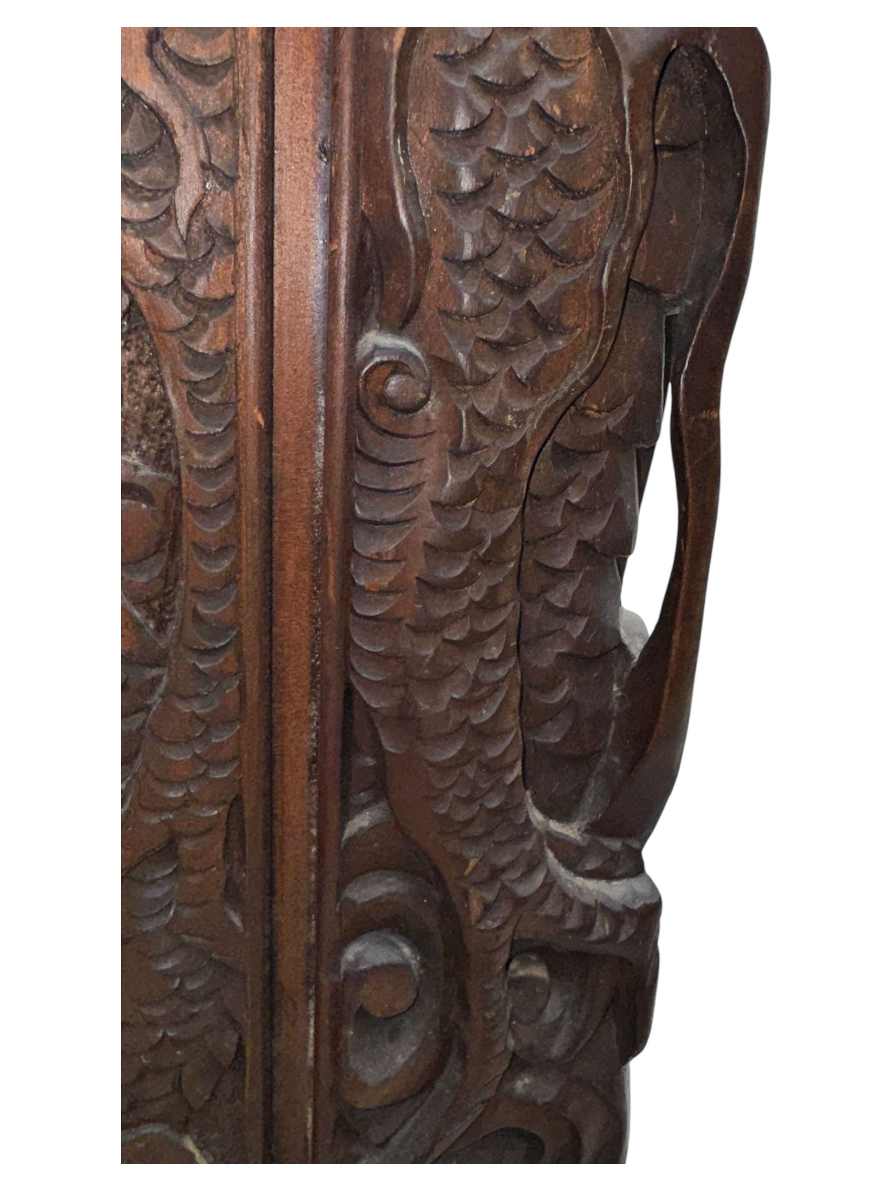 Meiji period (1868–1912), Shibayama lacquer carved hardwood two-fold screen inlaid with mother-of-pearl, bone, and ivory, decorated on one side in high relief and inlaid in a  Shibayama manner with oriental storks flying below flowering branches,  the reverse lacquer panels depicting flowering cherry trees. This item has been registered for sale under section 10 of the APHA Ivory Act.