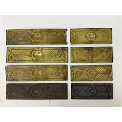 Two sets of four brass Art Nouveau finger plates, of rectangular form with repousse decoration, largest L31cm