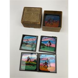 Set of twelve late 19th century magic lantern glass slides entitled 'A Negro's Life', together with forty-two further assorted late 19th/early 20th century magic lantern slides including Union Castle Line to South-East Africa by H.L. Toms London etc, housed in a wooden baize-lined box