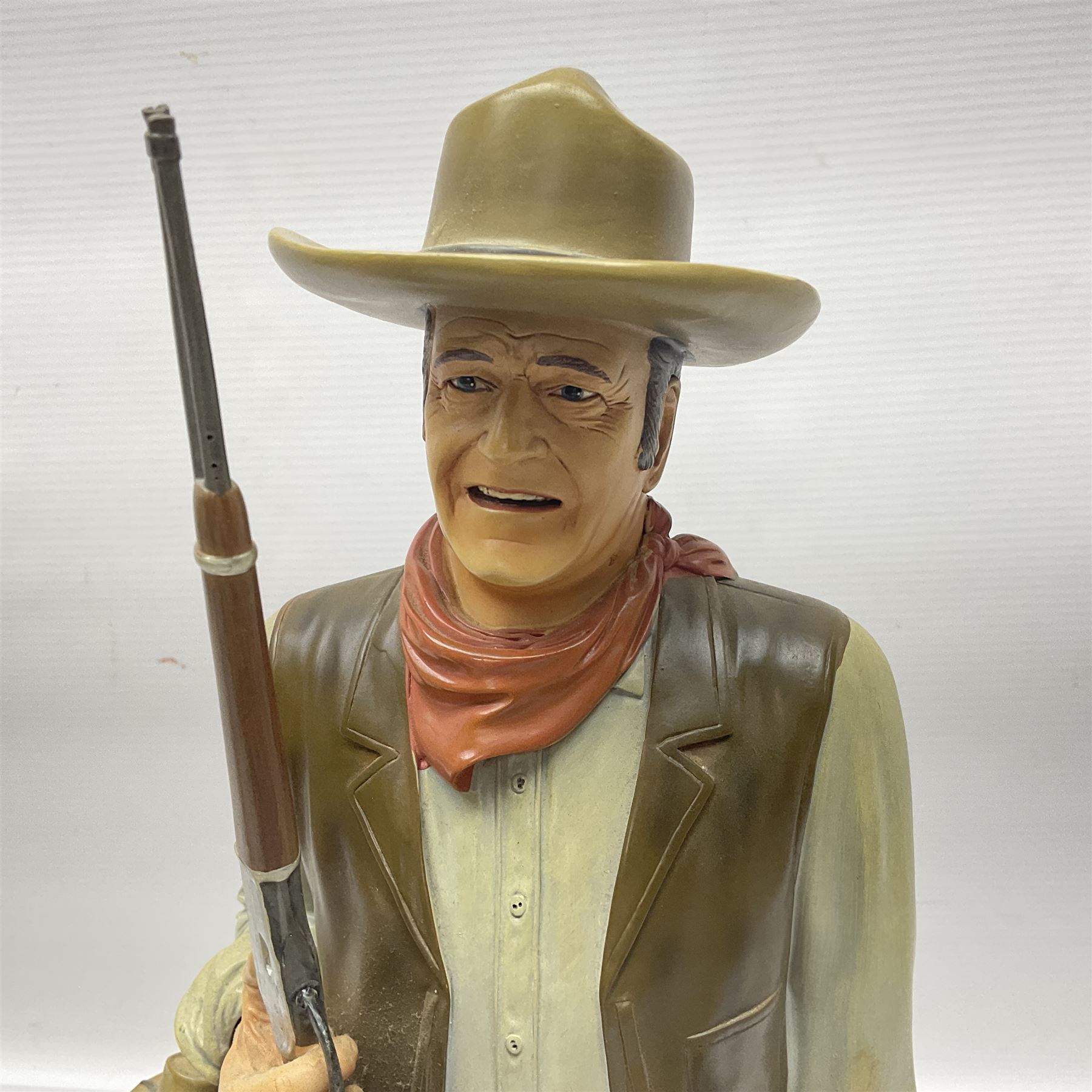 Beswick matte Hereford Bull, with stamped mark beneath, on wooden plinth, together with a limited edition Bradford Exchange John Wayne model, tallest H36cm