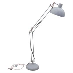 Contemporary white floor lamp, in the manner of Anglepoise, counter balance sprung arm, red cord with a weighted base 