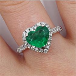 Platinum heart shaped Zambian emerald and diamond cluster ring, with diamond set shoulders, hallmarked, emerald approx 1.85 carat, total diamond weight approx 0.35 carat 