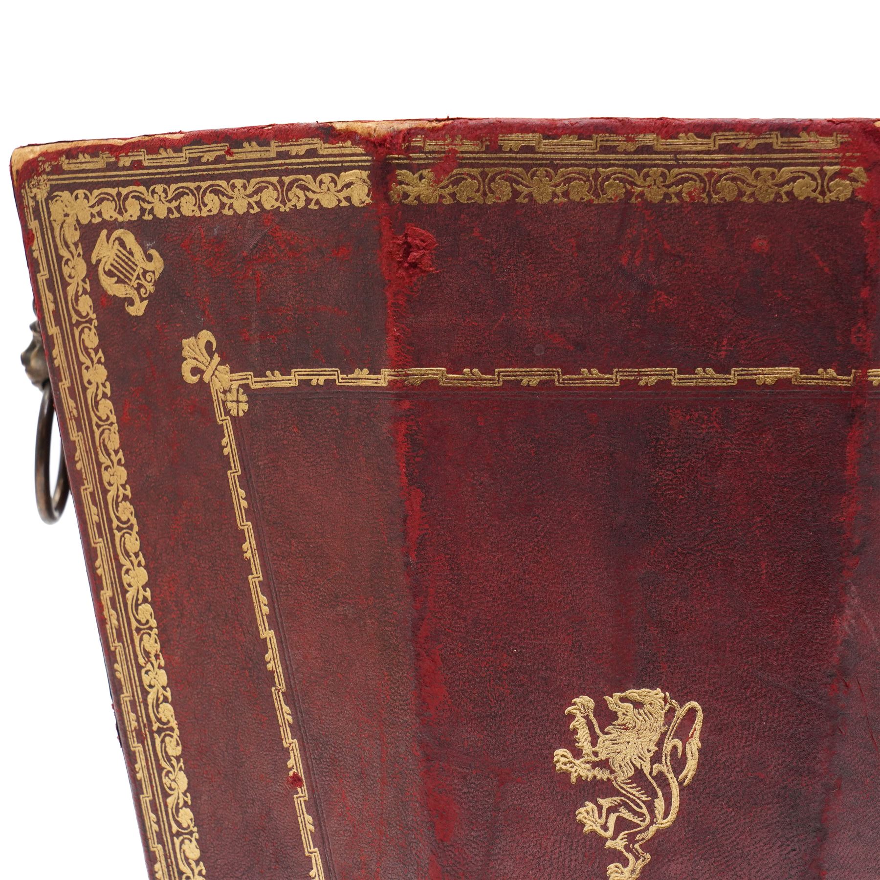 Regency style burgundy leather waste paper bucket of tapering octagonal form with gilt-tooled borders, sides fitted with lion mask ring handles, interior lined with marbled paper, circa 1900