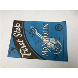 Late 19th/early 20th century Italian lute back mandolin with segmented back and spruce top; bears maker's label for Pietro Tonelli Napoli; together with a mandolin instruction booklet and a folding music stand L60.5cm