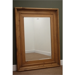  Large moulded pine framed bevel edge mirror, W96cm, H127cm  
