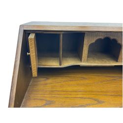 Old Charm oak bureau, fitted with fall front above four drawers