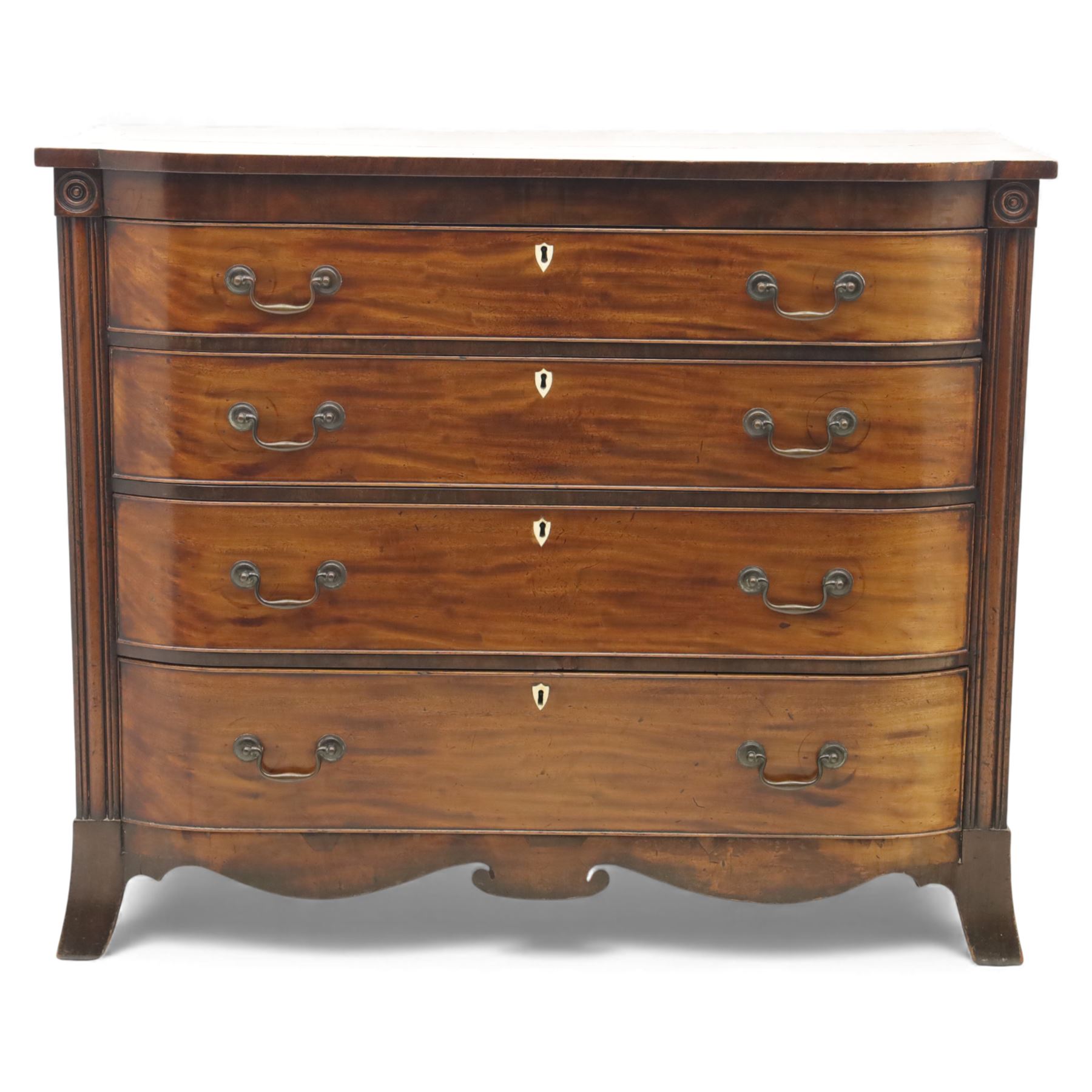 19th century mahogany bow fronted chest, the moulded top over four long cock-beaded drawers with brass swan neck handles and shield shaped bone escutcheons, flanked by reeded uprights, raised upon shaped bracket feet
