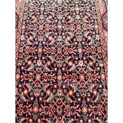 North West Persian Mahal indigo ground runner rug, the field decorated with all-over crimson Herati motifs, the guarded border with trailing geometric designs