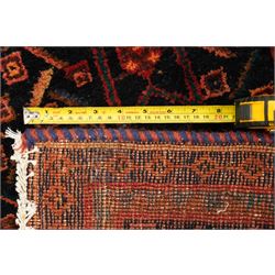 Large Persian indigo ground Herati runner rug, the busy field decorated with repeating geometric and Herati motifs in contrasting tones, enclosed by multiple guard stripes